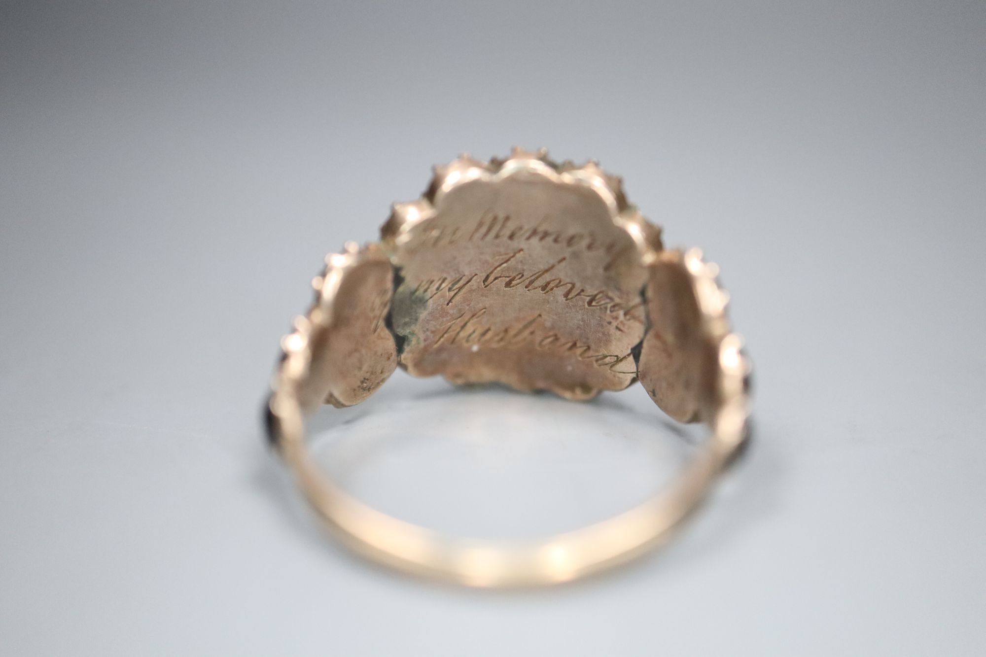 A William IV gold and jet memorial ring with central hair work panel, the underside inscribed In Memory of my beloved Husband, gross